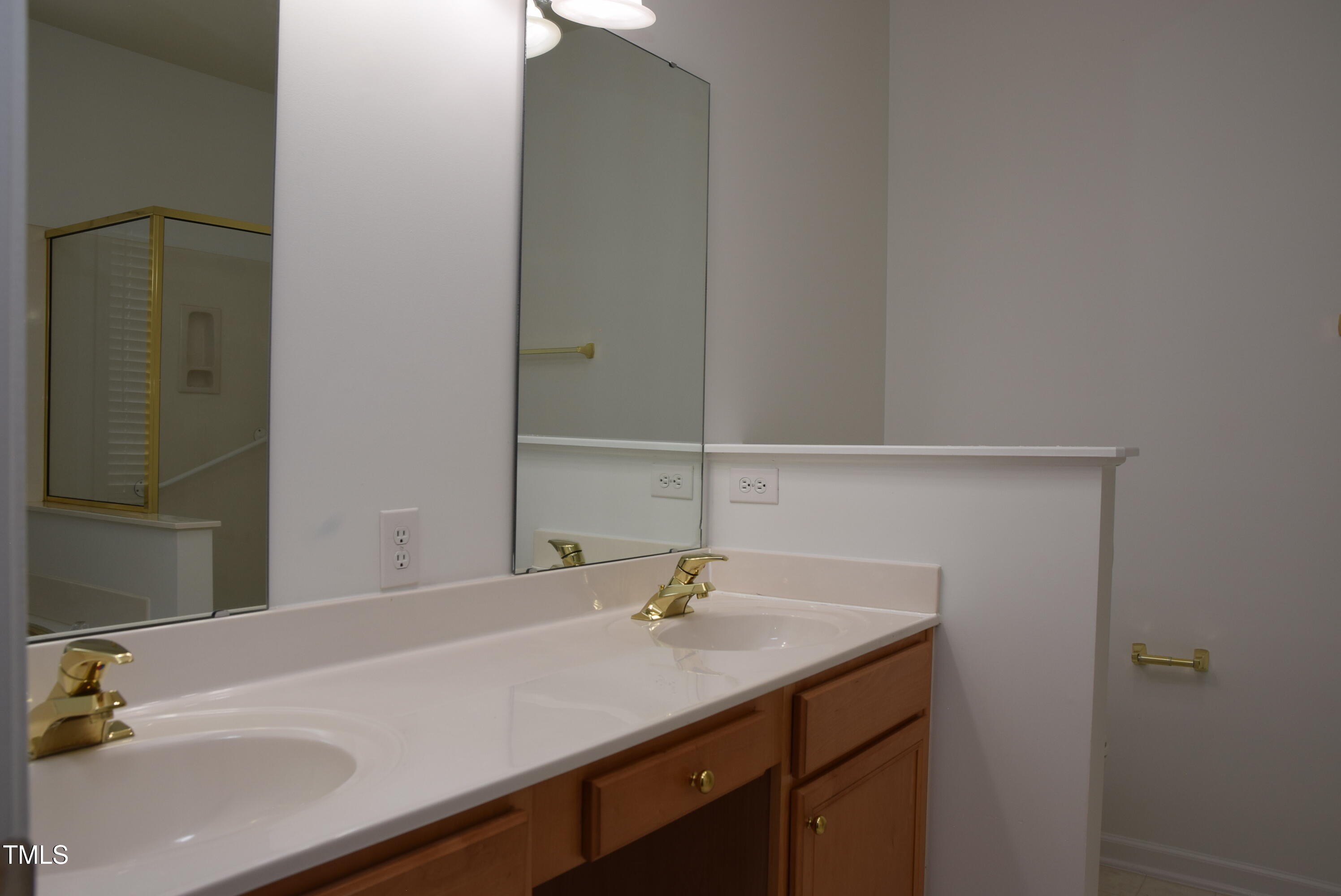 10461 Dapping Drive Raleigh, NC 27614 - Photo 17 of 29 a bathroom with a sink and a mirror