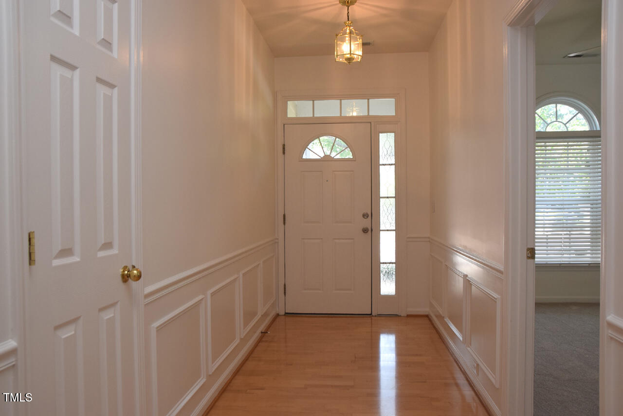 10461 Dapping Drive Raleigh, NC 27614 - Photo 3 of 29 a view of a hallway with entryway door
