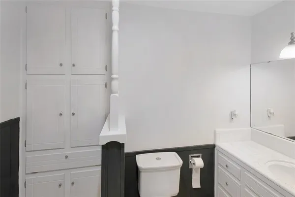 a bathroom with a toilet and a sink