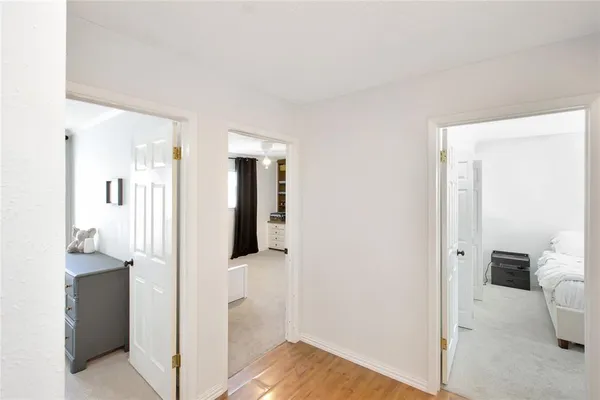 a view of a bathroom with sink and mirror