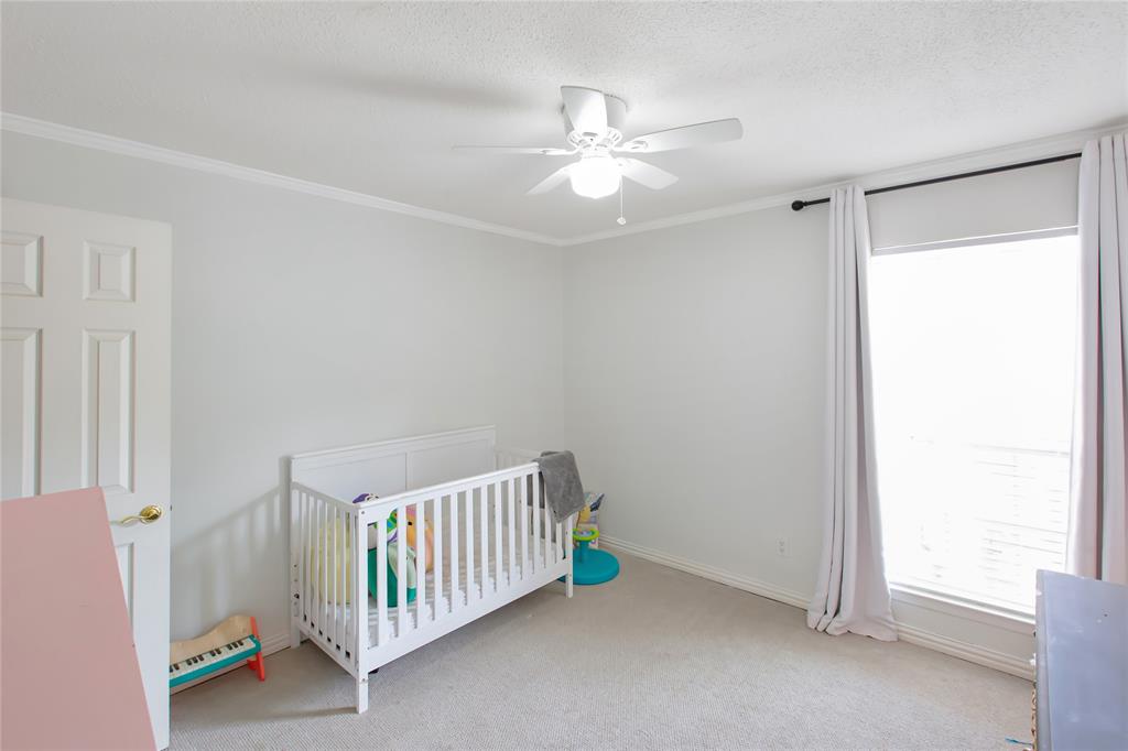 853 Royal Terrace Hurst, TX 76053 - Photo 14 of 34 a view of a room with a window and ceiling fan
