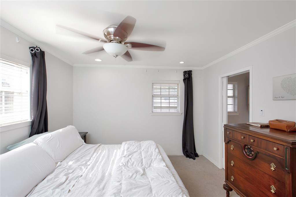 853 Royal Terrace Hurst, TX 76053 - Photo 23 of 34 a bedroom with a bed and a ceiling fan