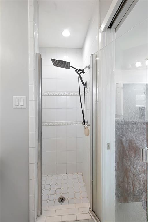 853 Royal Terrace Hurst, TX 76053 - Photo 26 of 34 a bathroom with a glass shower door