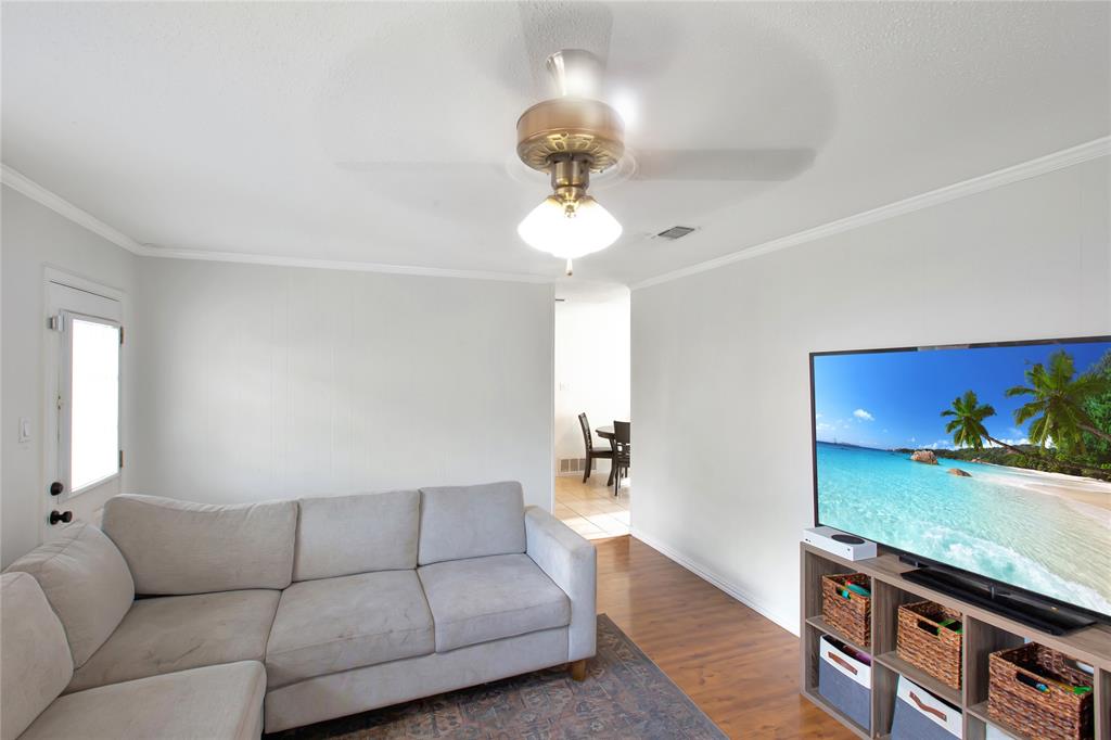 853 Royal Terrace Hurst, TX 76053 - Photo 3 of 34 a living room with furniture and a chandelier