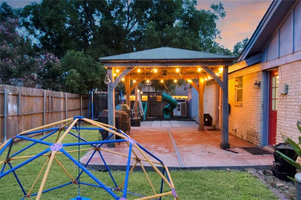 a view of yard with deck and seating space
