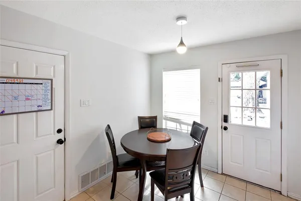 a view of a dining room with furniture and window