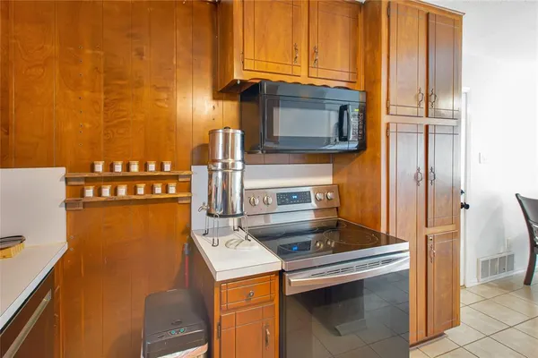 a kitchen with a stove and a refrigerator