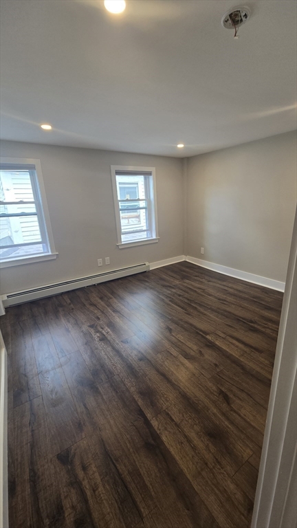 15 Central Street, Unit 4 Georgetown, MA 01833 - Photo 5 of 24 an empty room with wooden floor and windows