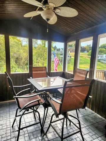 a view of a dining room with furniture window and outside view