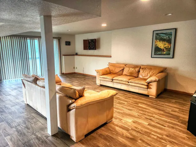 a living room with furniture and a rug