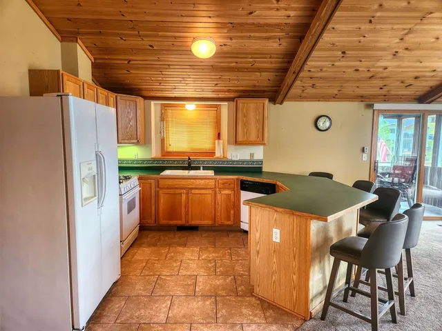 a kitchen with a stove a refrigerator and a stove