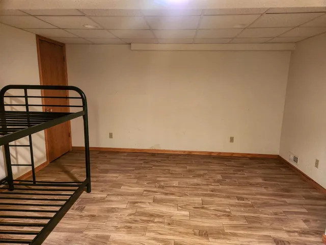 a view of wooden floor in an empty room