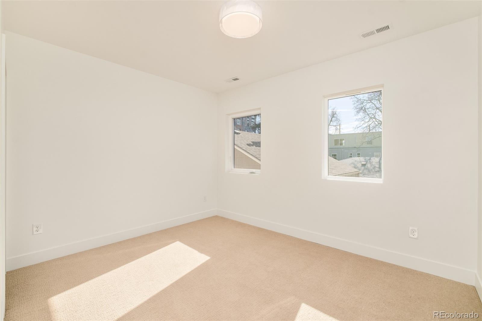2357 South High Street Denver, CO 80210 - Photo 13 of 41 an empty room with windows