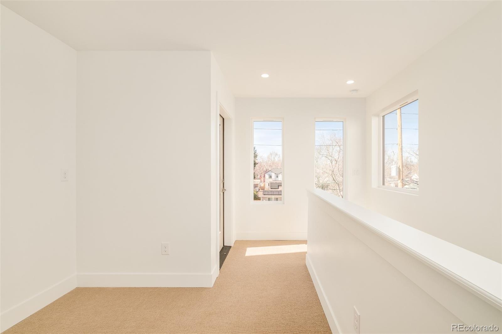 2357 South High Street Denver, CO 80210 - Photo 15 of 41 a view of an empty room with a window