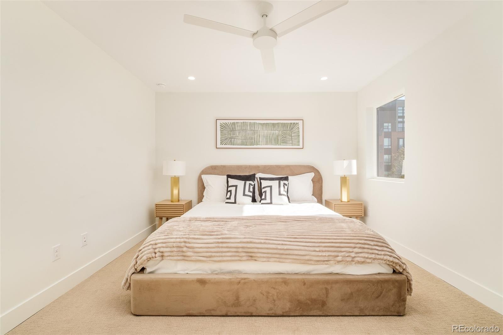 2357 South High Street Denver, CO 80210 - Photo 16 of 41 a large white bed in a white room