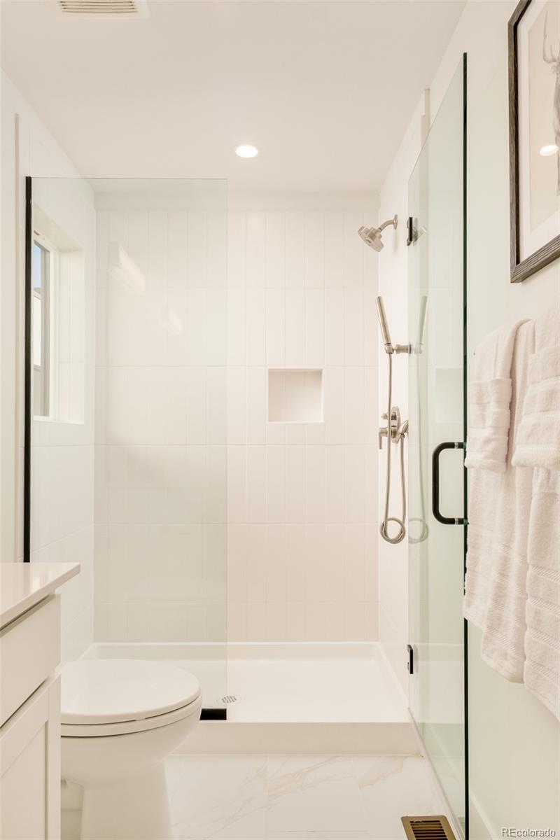 2357 South High Street Denver, CO 80210 - Photo 21 of 41 a bathroom with a shower