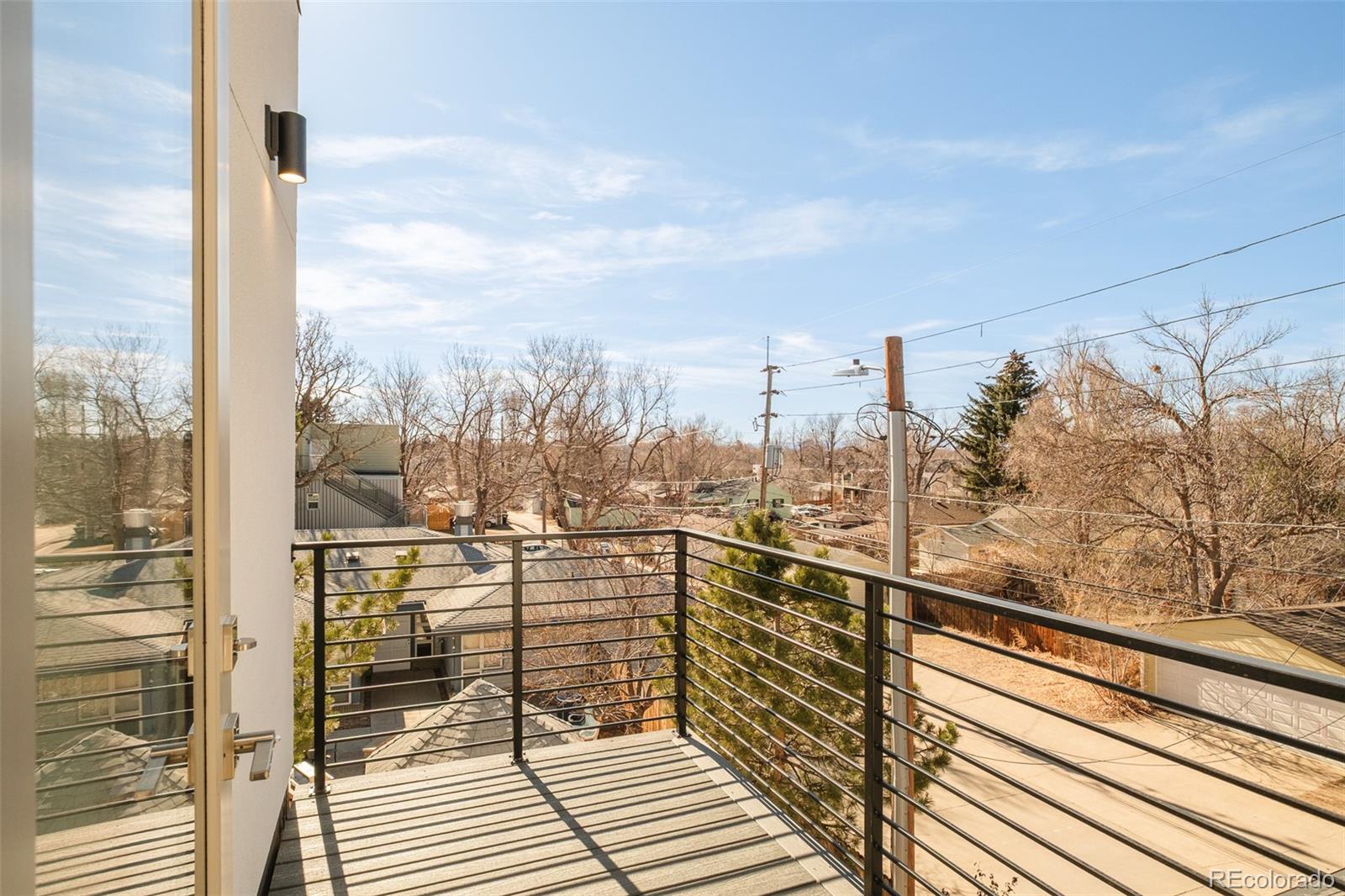 2357 South High Street Denver, CO 80210 - Photo 29 of 41 a view of a balcony with city view