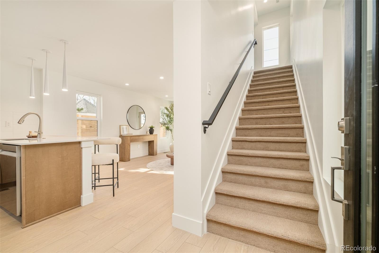 2357 South High Street Denver, CO 80210 - Photo 10 of 41 a view of entryway and hall with wooden floor