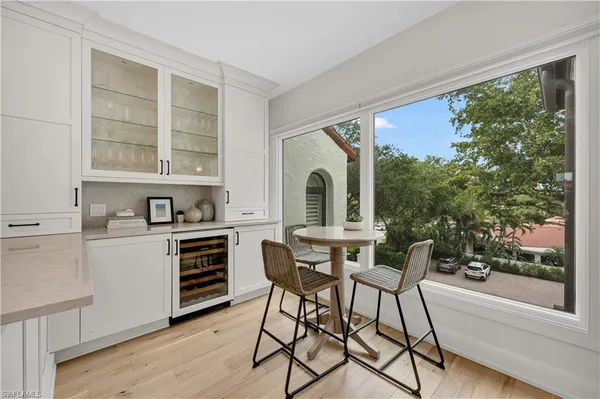 a view of a dining room with furniture and a window