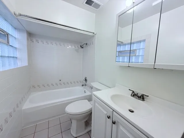 a bathroom with a bathtub a sink and a toilet