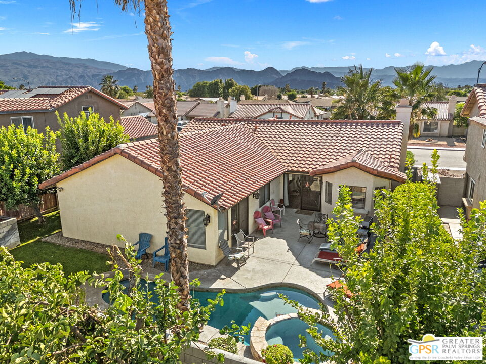 45688 Sutter Creek Road Indio, CA 92201 - Photo 49 of 51 a aerial view of a house with a yard and lake view
