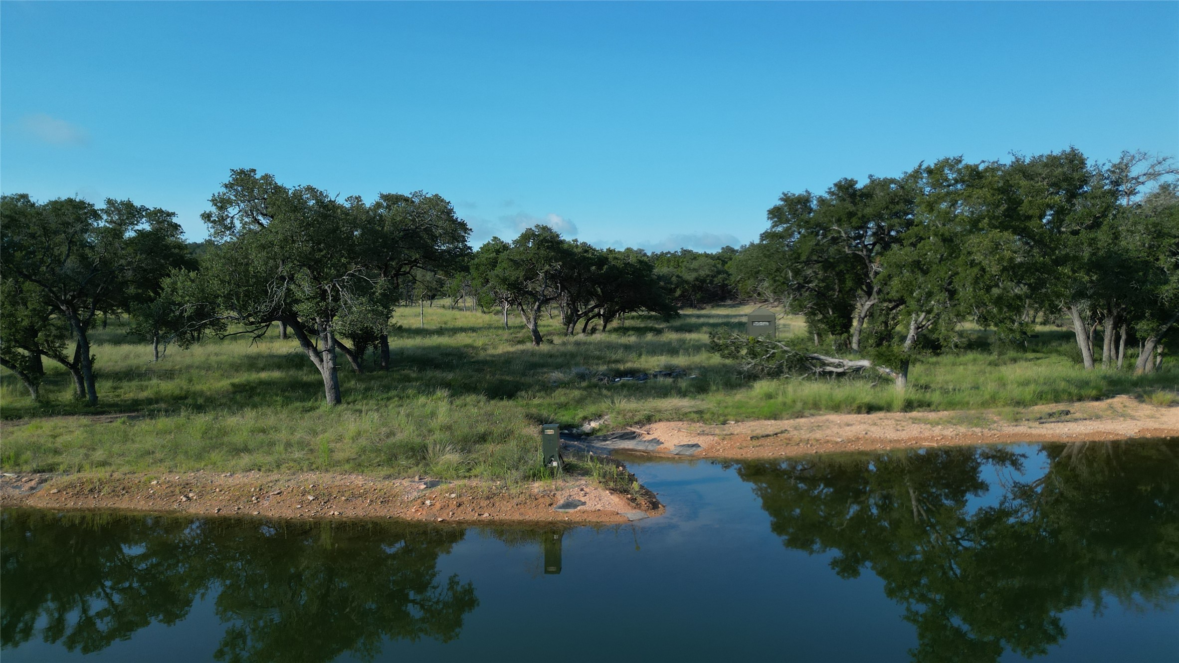 7819 Ranch To Market Road 2766 Ranch Johnson City, TX 78636 - Photo 13 of 30 a view of a lake view with green space