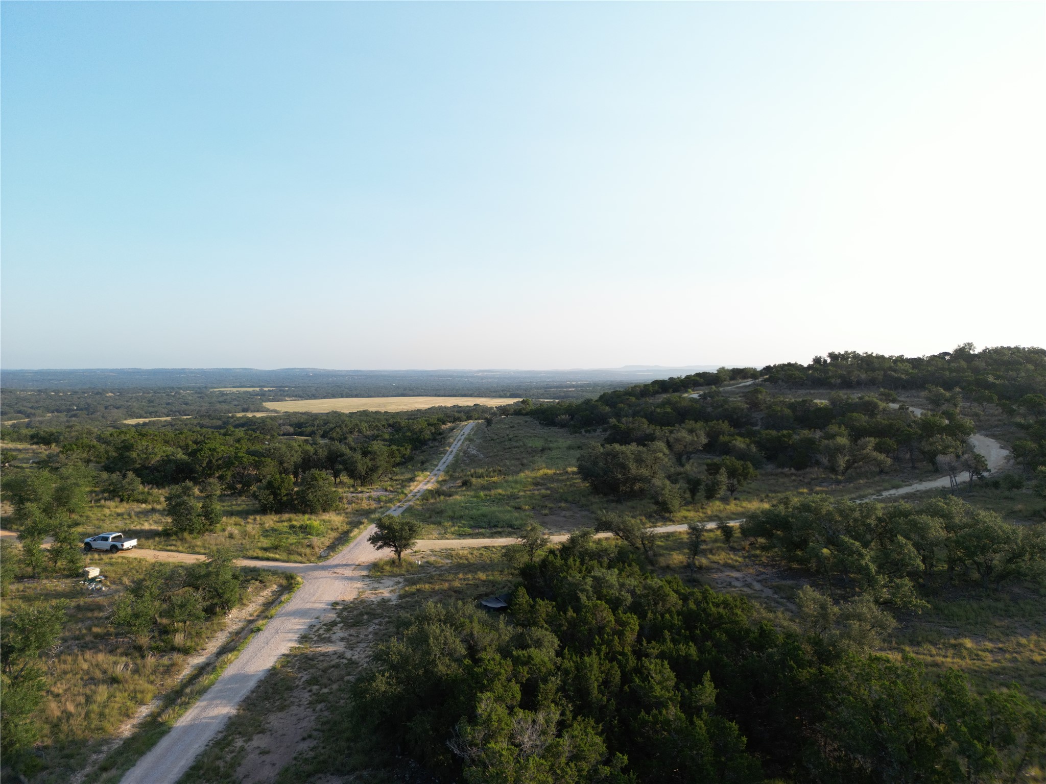 7819 Ranch To Market Road 2766 Ranch Johnson City, TX 78636 - Photo 4 of 30 an aerial view of residential houses with outdoor space and trees