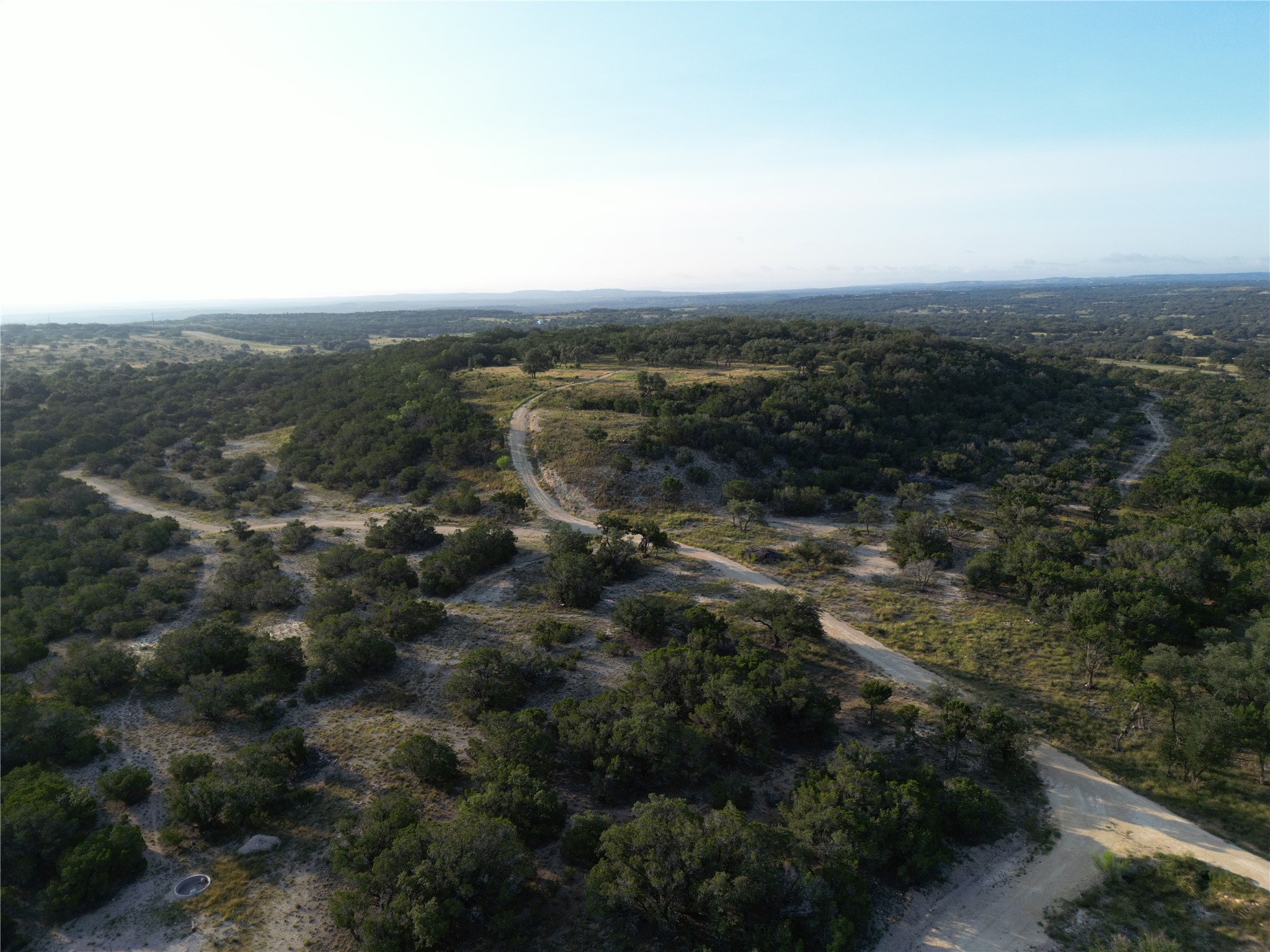 7819 Ranch To Market Road 2766 Ranch Johnson City, TX 78636 - Photo 10 of 30 an aerial view of house with yard and mountain view in back
