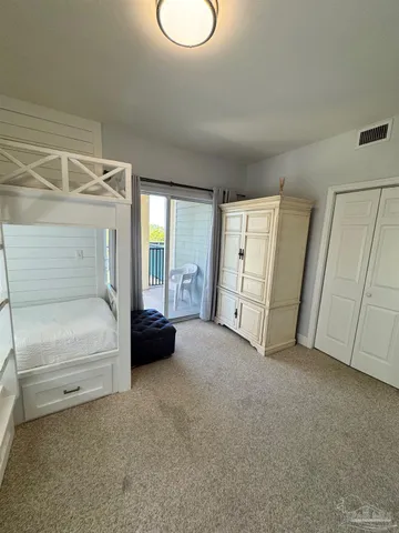 a view of a livingroom with furniture and closet