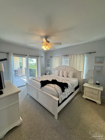 a spacious bedroom with a bed and a couch