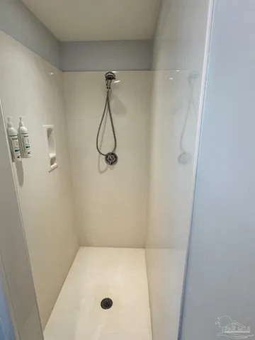 a bathroom with a bath tub and shower