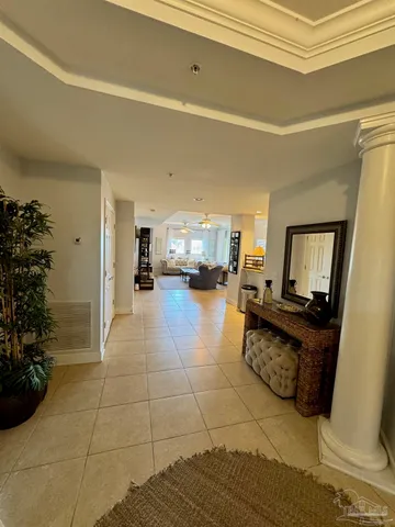 a living room with furniture and flowers