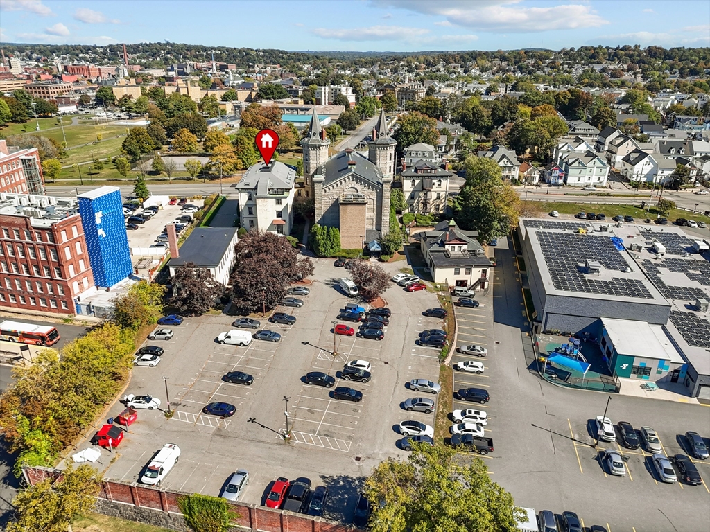 201 Thorndike Street, Unit 123 Lowell, MA 01852 - Photo 26 of 28 an aerial view of residential houses with outdoor space