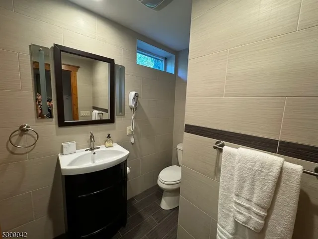 a living room with couches and a flat screen tv