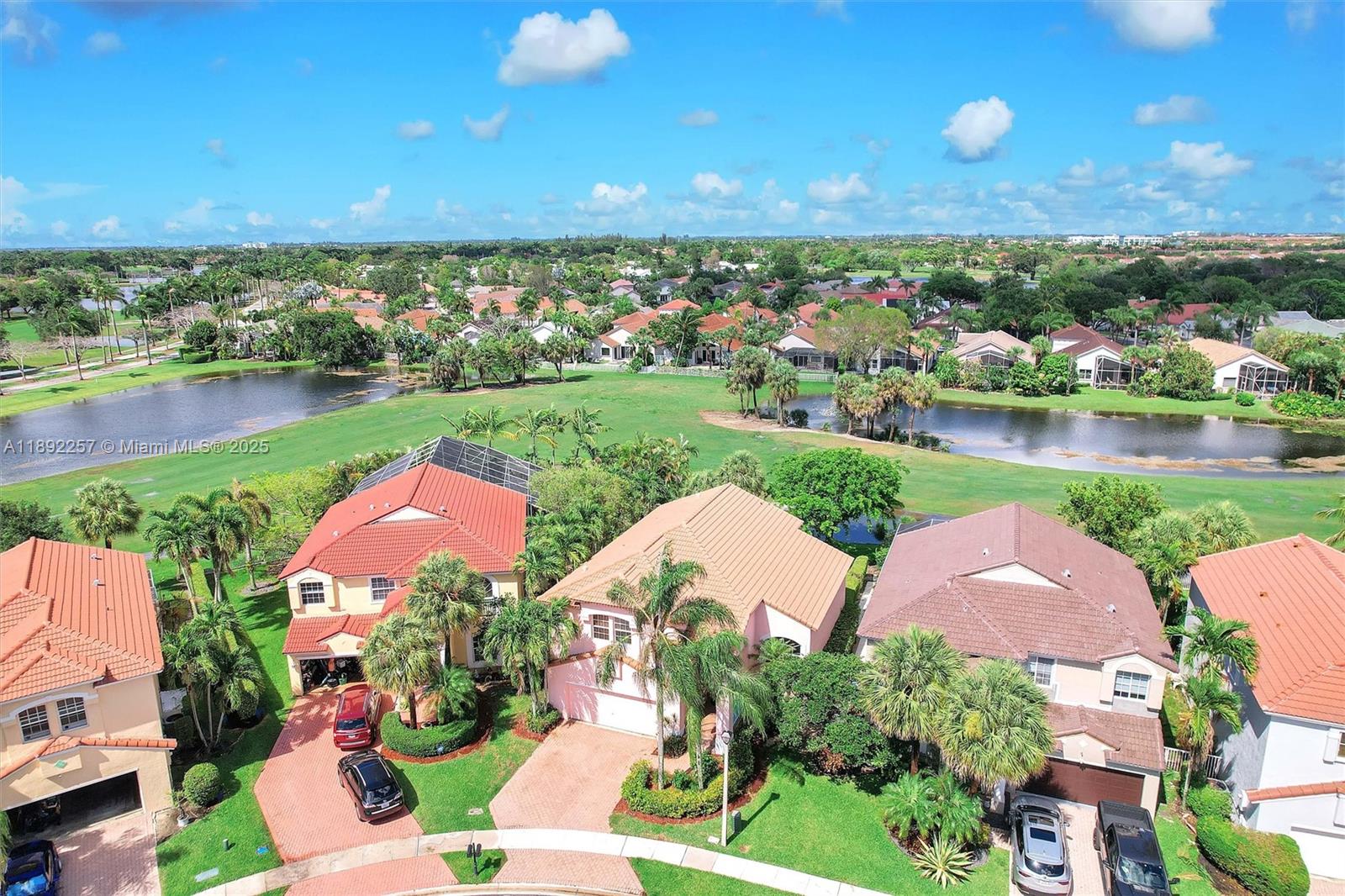 an aerial view of a house with swimming pool outdoor seating and yard