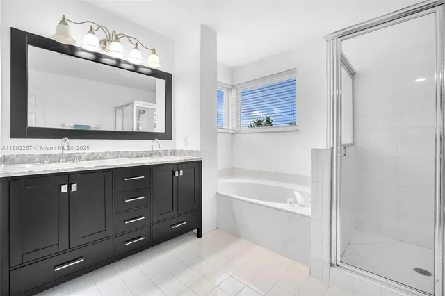 a bathroom with a bathtub and shower