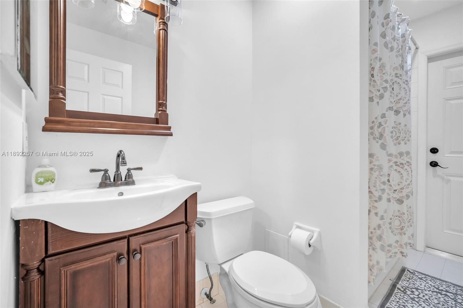 1637 Southwest 156th Avenue Pembroke Pines, FL 33027 - Photo 21 of 27 a bathroom with a sink a toilet and shower