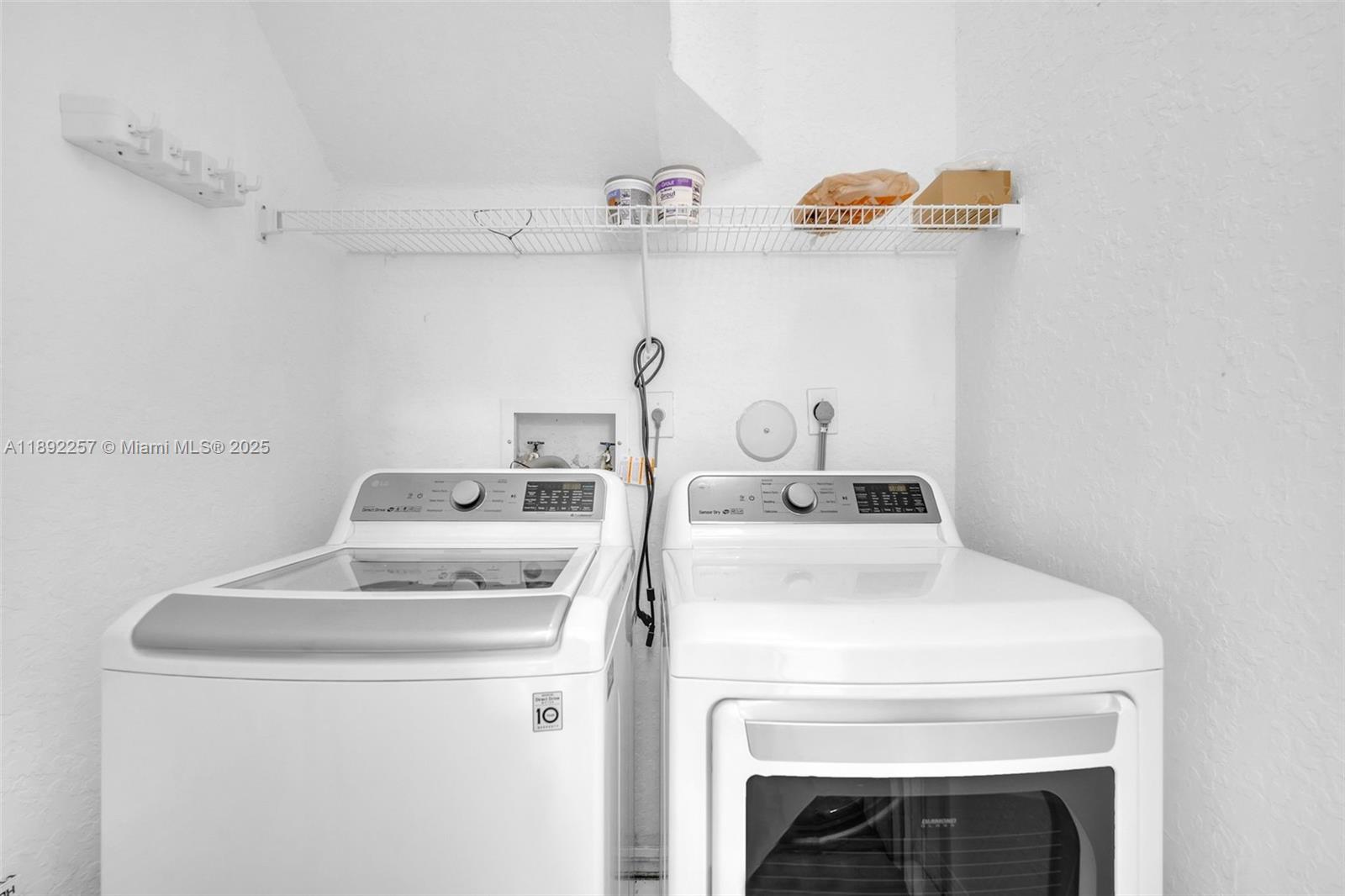 1637 Southwest 156th Avenue Pembroke Pines, FL 33027 - Photo 22 of 27 a utility room with dryer and washer