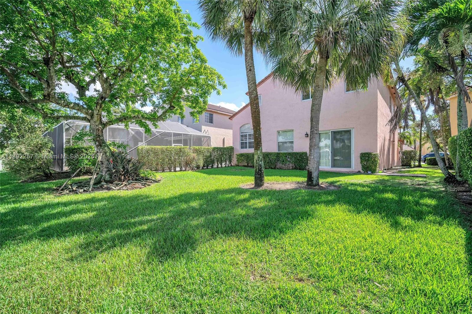 1637 Southwest 156th Avenue Pembroke Pines, FL 33027 - Photo 24 of 27 a view of a garden with a tree