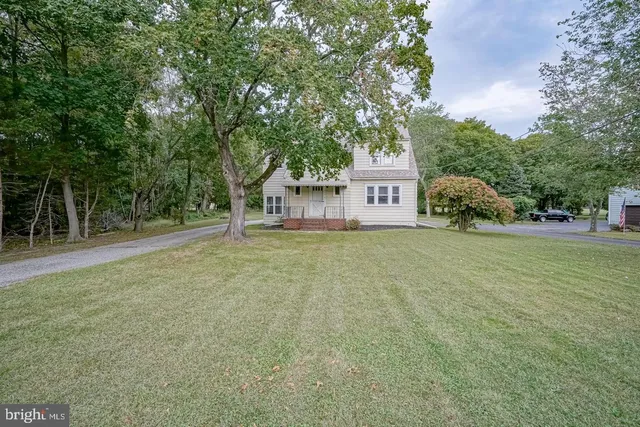 a house with trees in front of it