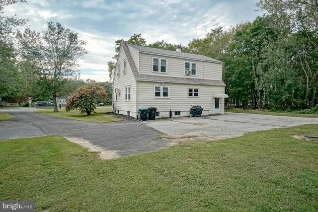 a view of house with yard