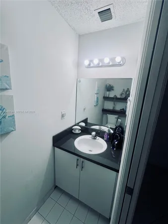 a bed sitting in a room next to a window