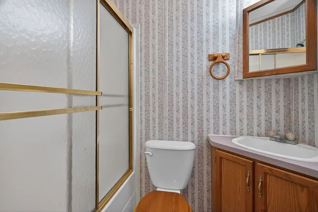 a view of a livingroom with furniture and staircase