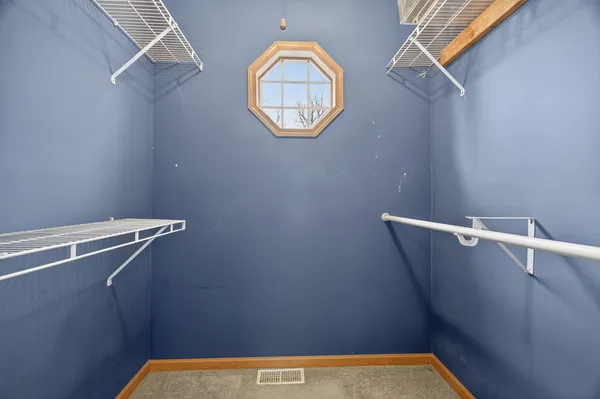 a view of a room with racks on the wall