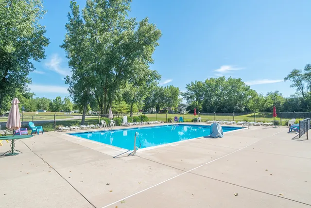 a view of a swimming pool with a lounge chairs