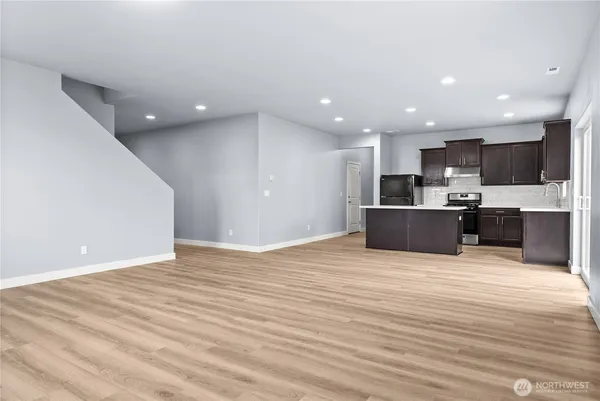 a view of kitchen and kitchen with a flat screen tv