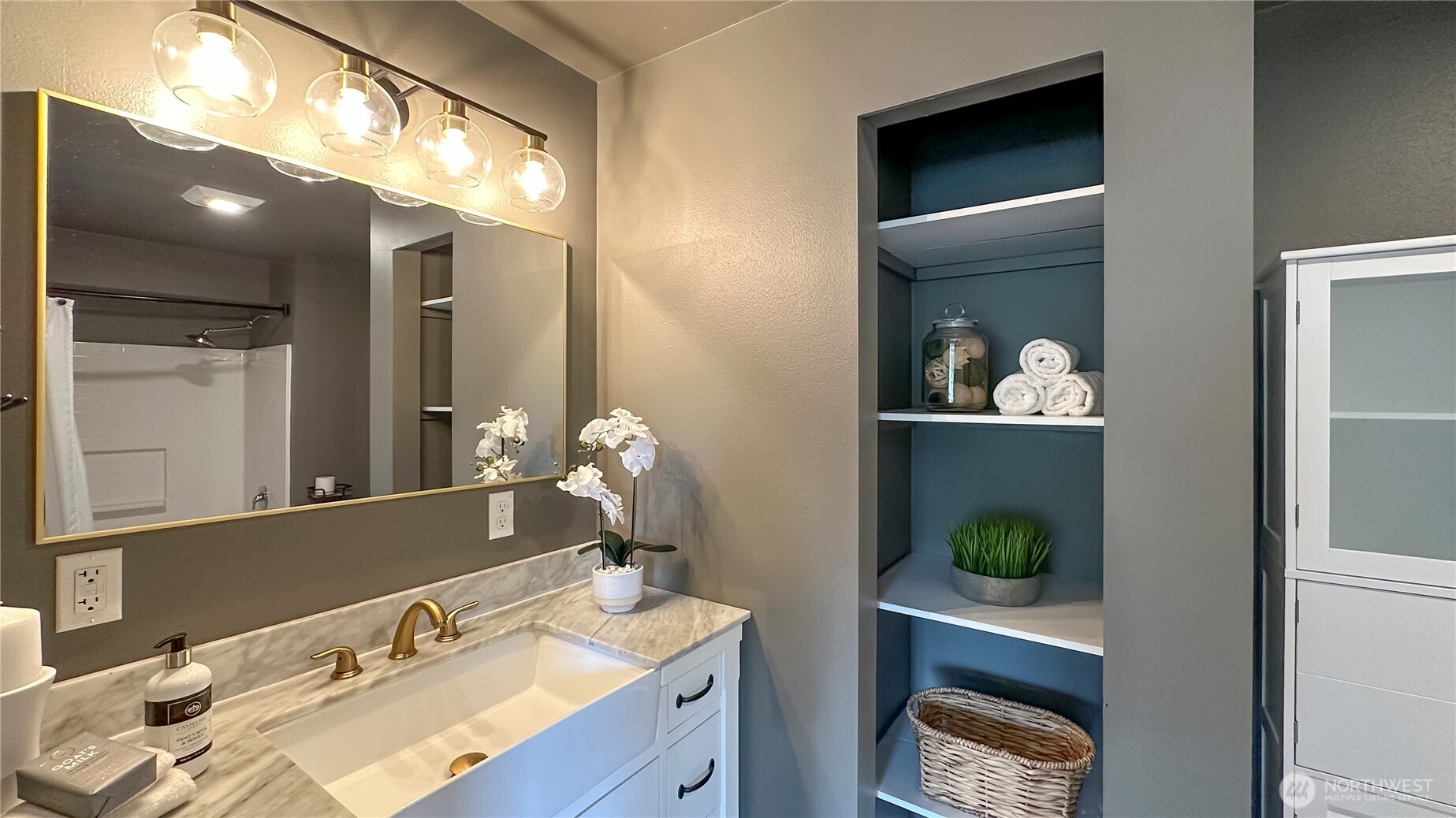 912 Northeast 115th Street Seattle, WA 98125 - Photo 14 of 21 a bathroom with a sink and a mirror