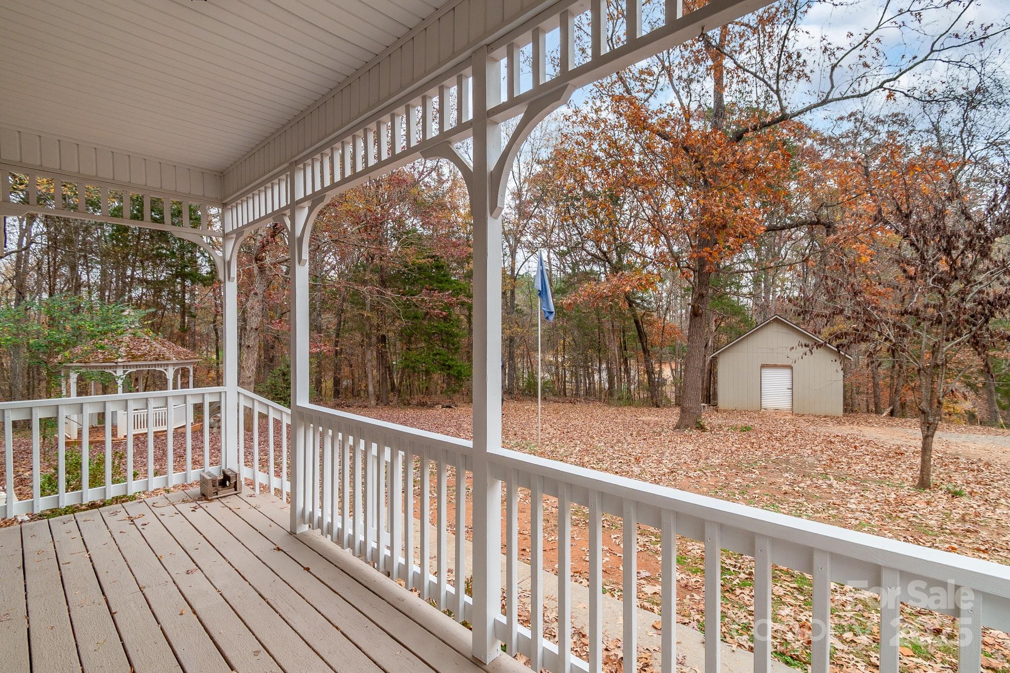 3687 East North Corner Road Lancaster, SC 29720 - Photo 8 of 47 a view of a house with large windows and a small yard