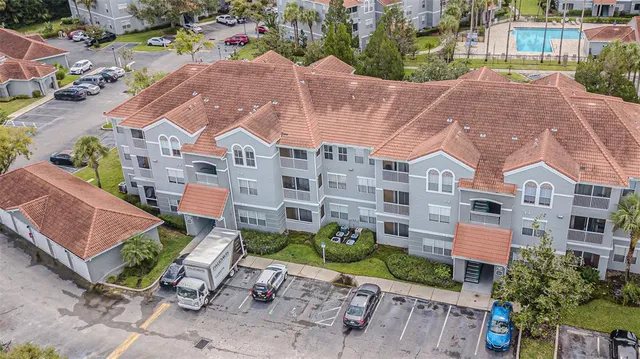 a aerial view of a house with garden space and street view