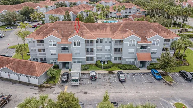 an aerial view of multiple houses with yard
